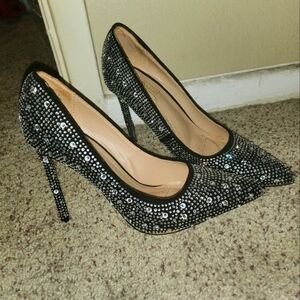 Black rhinestone slip on pumps.